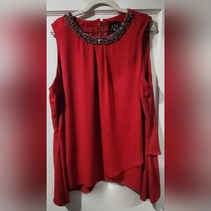 Chic Red Sleeveless Blouse with Embellished Neckline